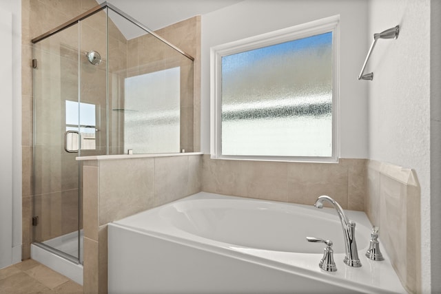 bathroom with independent shower and bath