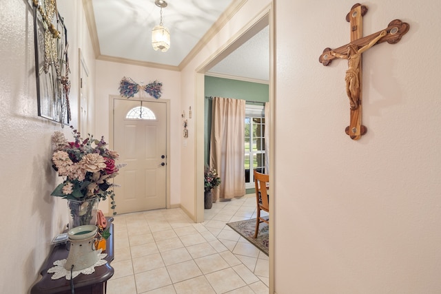 tiled entryway featuring ornamental molding