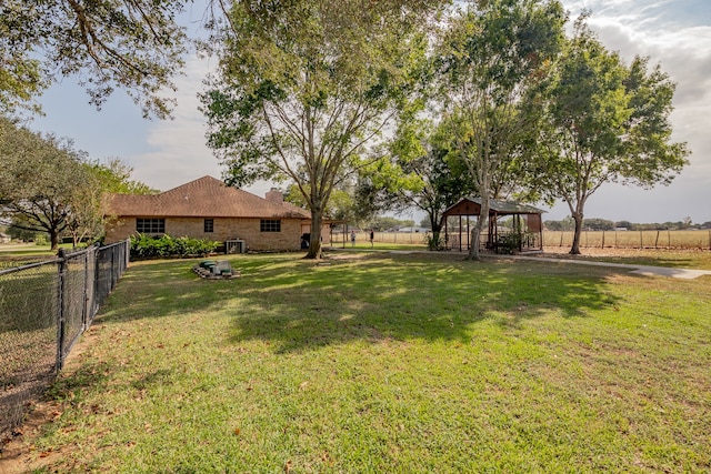 view of yard featuring a gazebo, a rural view, and central AC unit