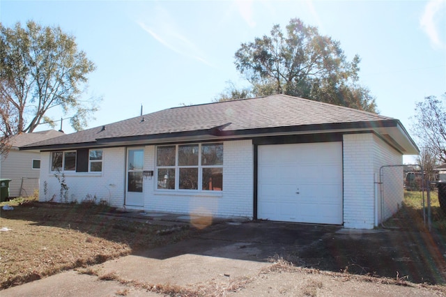 rear view of house with a garage