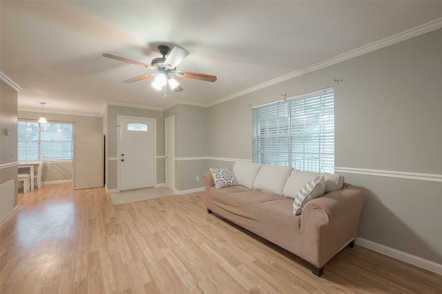 living room featuring ceiling fan, light hardwood / wood-style floors, and ornamental molding