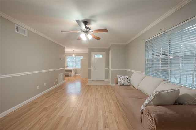 unfurnished living room featuring ceiling fan, light hardwood / wood-style floors, and crown molding