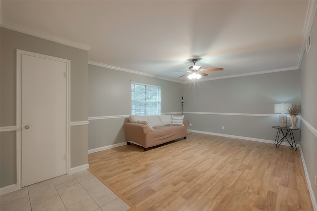 unfurnished room with crown molding, ceiling fan, and light hardwood / wood-style floors