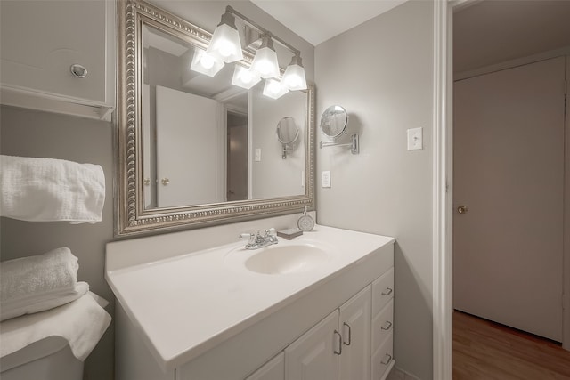 bathroom featuring vanity and hardwood / wood-style flooring