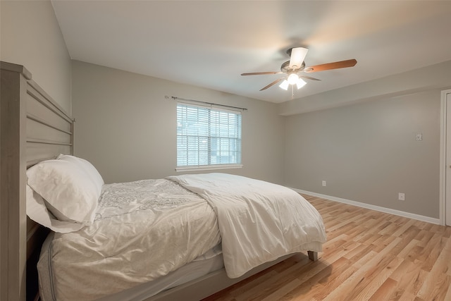 bedroom featuring ceiling fan and light wood-type flooring