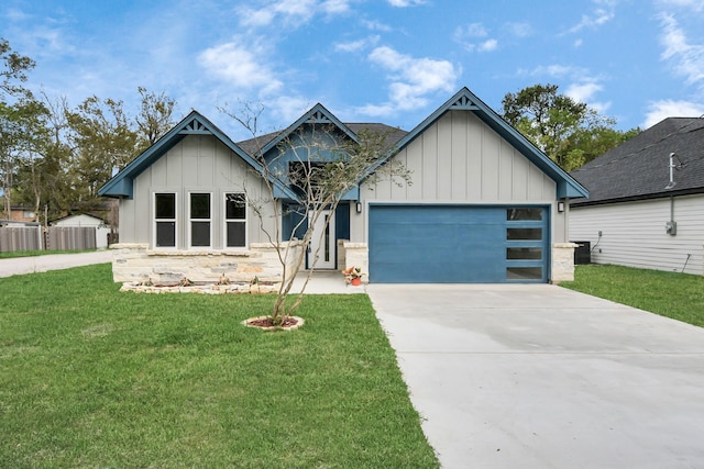 view of front of property with a garage and a front lawn