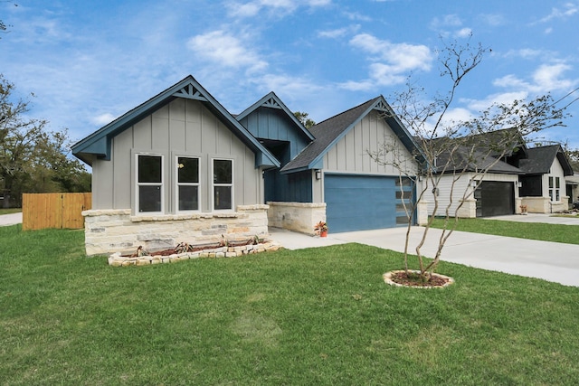 view of front of property with a garage and a front lawn