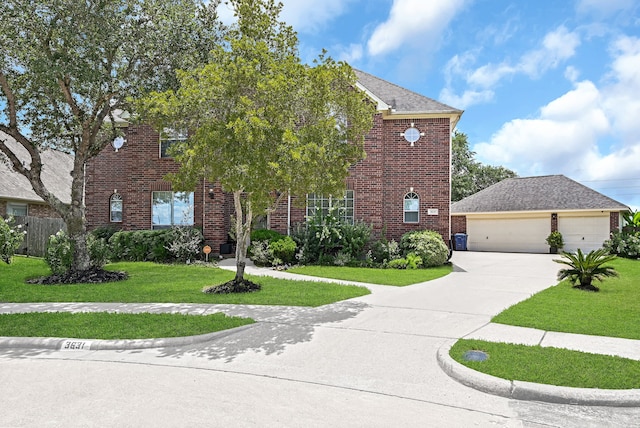 view of front facade with a garage and a front yard