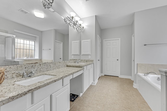 bathroom with tile patterned flooring, a textured ceiling, vanity, and separate shower and tub