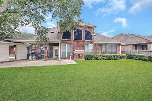 back of house featuring a patio area and a yard