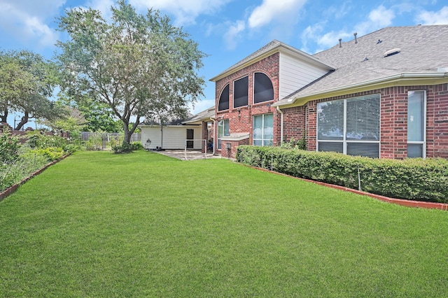 rear view of property with a patio area and a yard