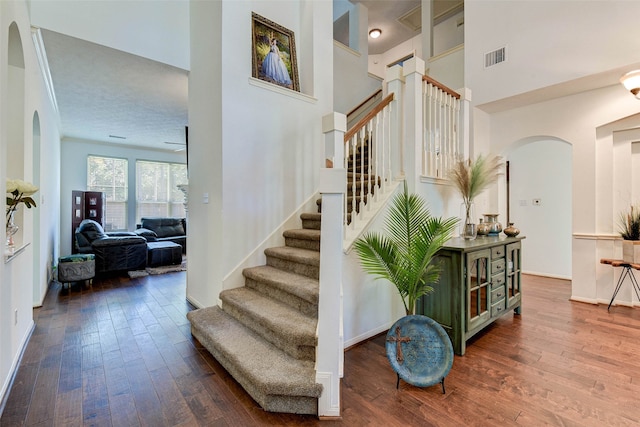 stairs with hardwood / wood-style floors