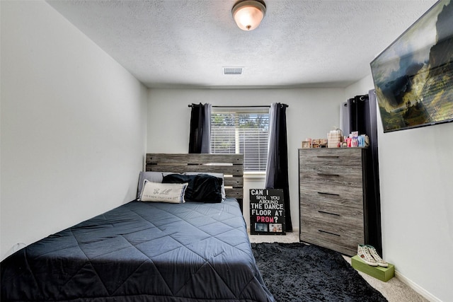 31202 Deerwood Park Ln, Spring City, TX 77386 - carpeted bedroom with a textured ceiling