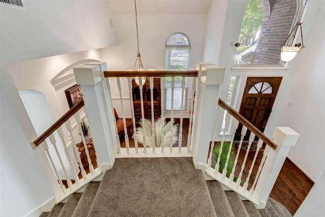 31202 Deerwood Park Ln, Spring City, TX 77386 - entrance foyer with stairs, a high ceiling, and baseboards