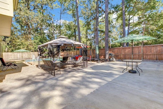 31202 Deerwood Park Ln, Spring City, TX 77386 - fenced backyard featuring a gazebo and a patio area