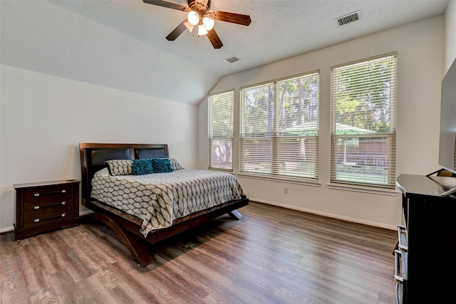 31202 Deerwood Park Ln, Spring City, TX 77386 - bedroom with wood finished floors, vaulted ceiling, baseboards, and ceiling fan