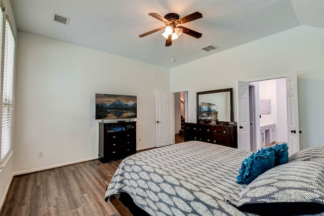 bedroom featuring connected bathroom, ceiling fan, dark hardwood / wood-style flooring, and lofted ceiling