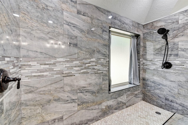 31202 Deerwood Park Ln, Spring City, TX 77386 - full bath with tiled shower and a textured ceiling