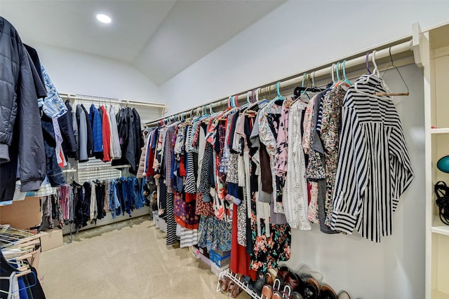 spacious closet featuring carpet flooring and lofted ceiling