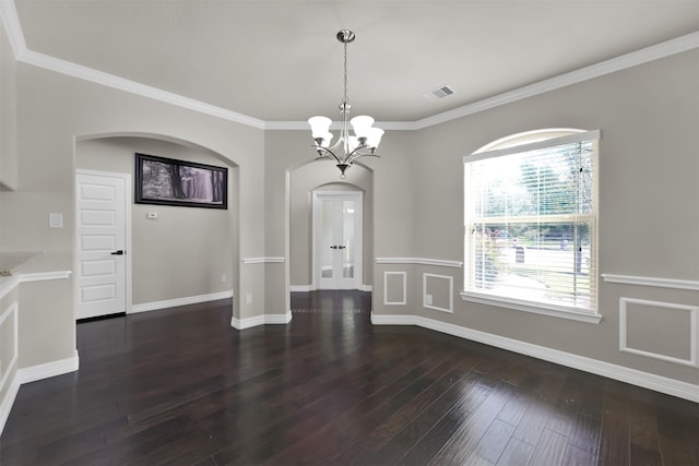 unfurnished dining area with crown molding, dark hardwood / wood-style flooring, and an inviting chandelier