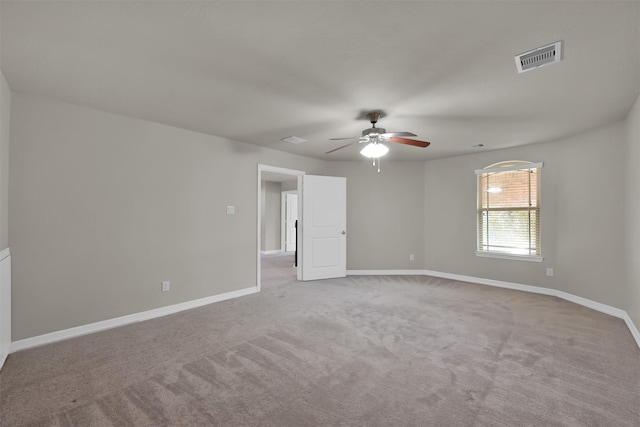 carpeted empty room featuring ceiling fan