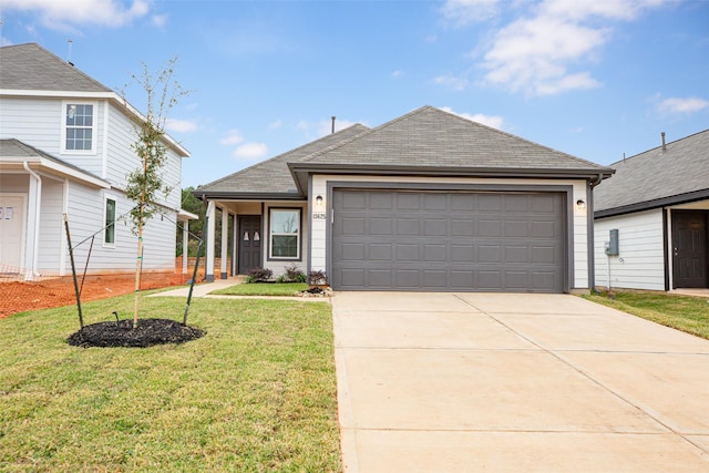 view of front of house featuring a garage and a front yard