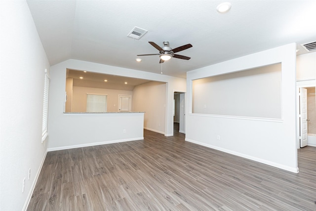 unfurnished living room featuring ceiling fan, vaulted ceiling, and hardwood / wood-style flooring