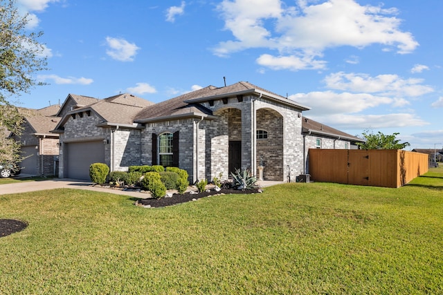 view of front facade featuring a front lawn and a garage