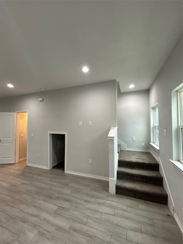 stairway featuring wood-type flooring