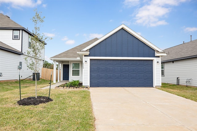 view of front facade featuring a garage and a front yard