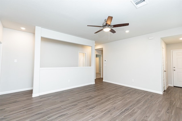 unfurnished room featuring ceiling fan and dark hardwood / wood-style flooring