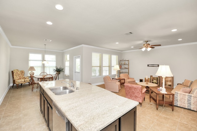 kitchen with pendant lighting, plenty of natural light, stainless steel dishwasher, and sink