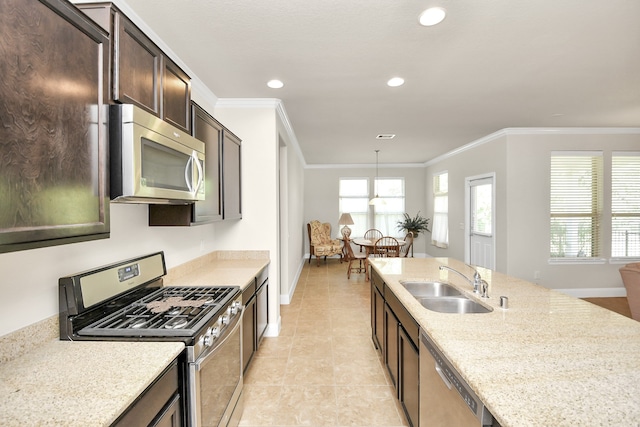 kitchen with sink, ornamental molding, decorative light fixtures, light stone counters, and stainless steel appliances