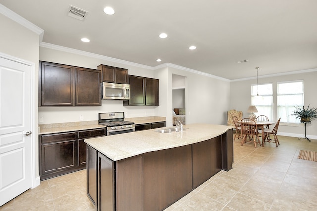 kitchen featuring pendant lighting, sink, ornamental molding, appliances with stainless steel finishes, and dark brown cabinets