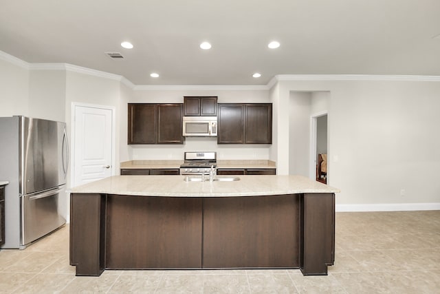 kitchen with a kitchen island with sink, dark brown cabinets, ornamental molding, and appliances with stainless steel finishes