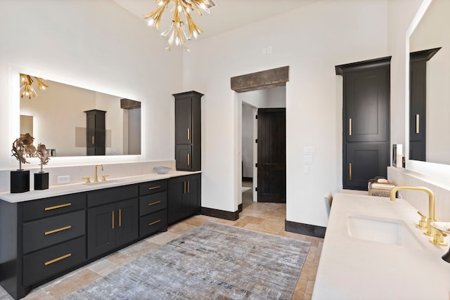 bathroom with vanity and an inviting chandelier