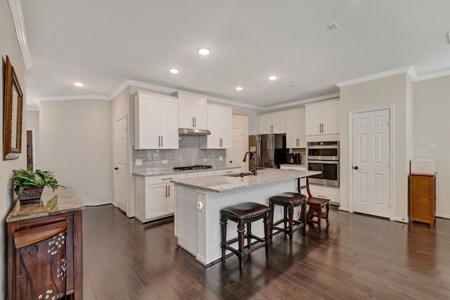 kitchen with dark hardwood / wood-style flooring, white cabinetry, and appliances with stainless steel finishes