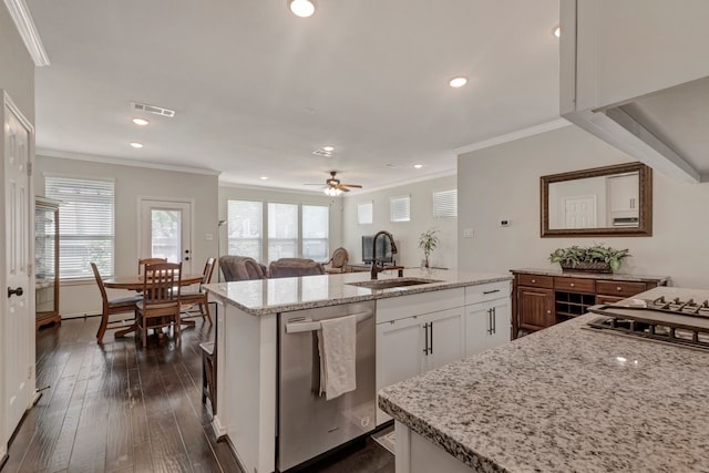 kitchen featuring stainless steel dishwasher, sink, a center island with sink, dark hardwood / wood-style floors, and white cabinetry