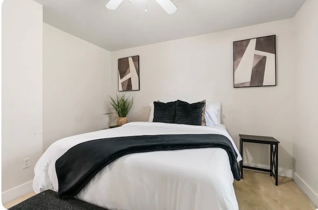 bedroom with light carpet and ceiling fan