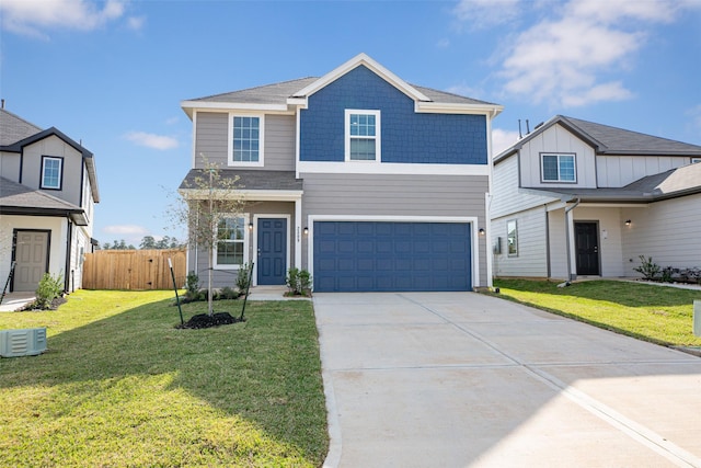 view of front of house featuring a garage and a front yard