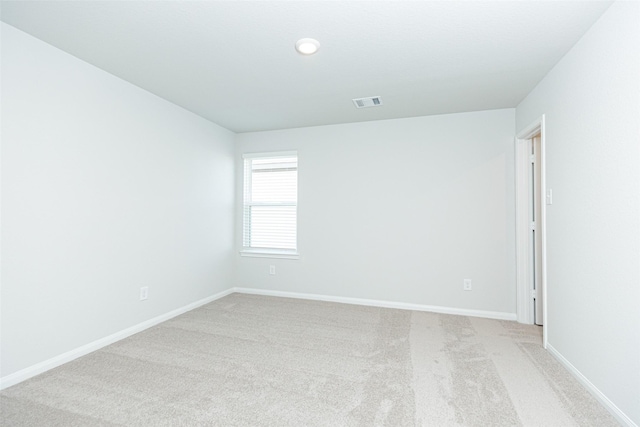 empty room featuring light carpet