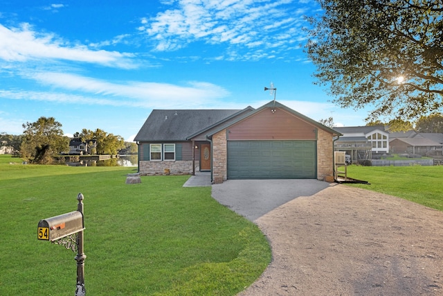 ranch-style home featuring a garage and a front yard