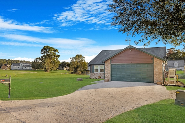 view of front of home featuring a garage and a front yard