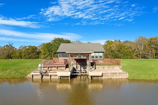 dock area featuring a lawn and a water view