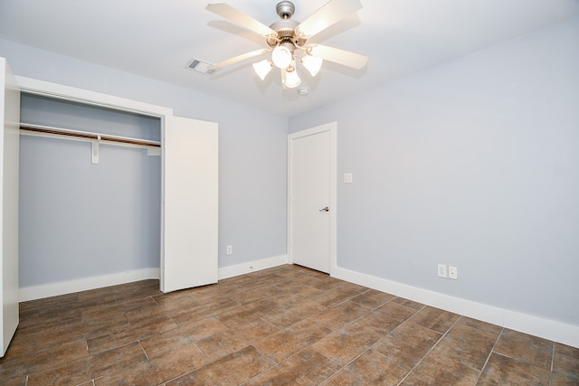 unfurnished bedroom with a closet and ceiling fan