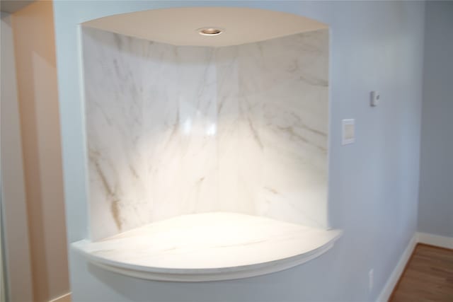 bathroom with wood-type flooring