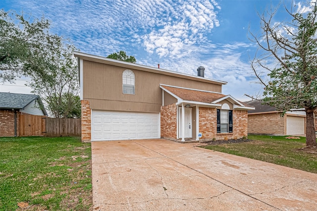 view of front of property featuring a front lawn and a garage