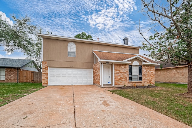 view of front of home featuring a front yard and a garage