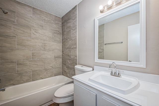 full bathroom featuring vanity, a textured ceiling, toilet, and tiled shower / bath