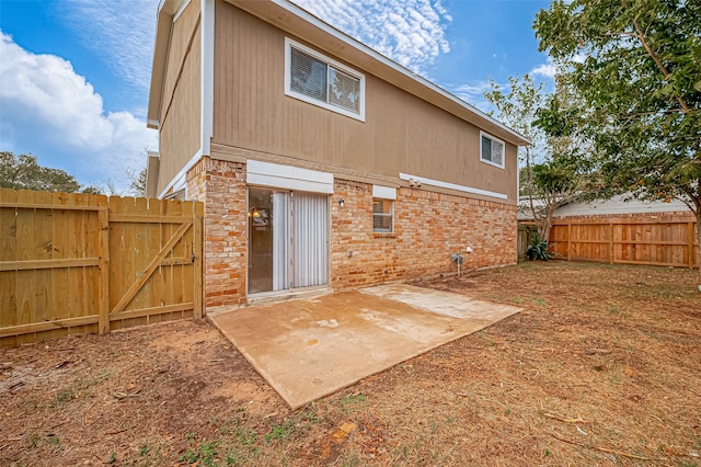 back of property featuring a patio